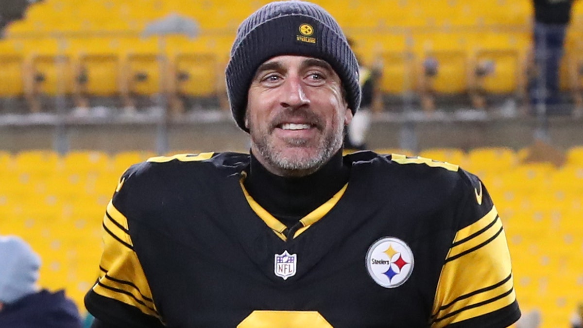 Pittsburgh Steelers quarterback Aaron Rodgers running off the field at Acrisure Stadium