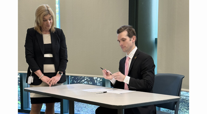 Lehigh County Executive Josh Siegel signs paid family leave legislation for county workers