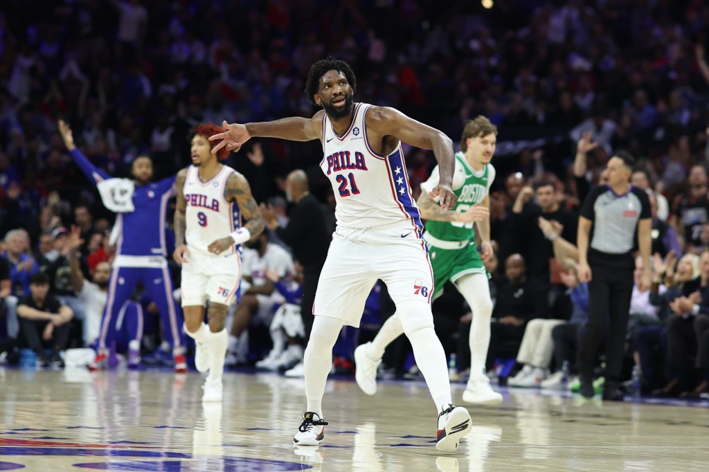 Philadelphia 76ers center Joel Embiid reacts after a three-pointer against the Boston Celtics.
