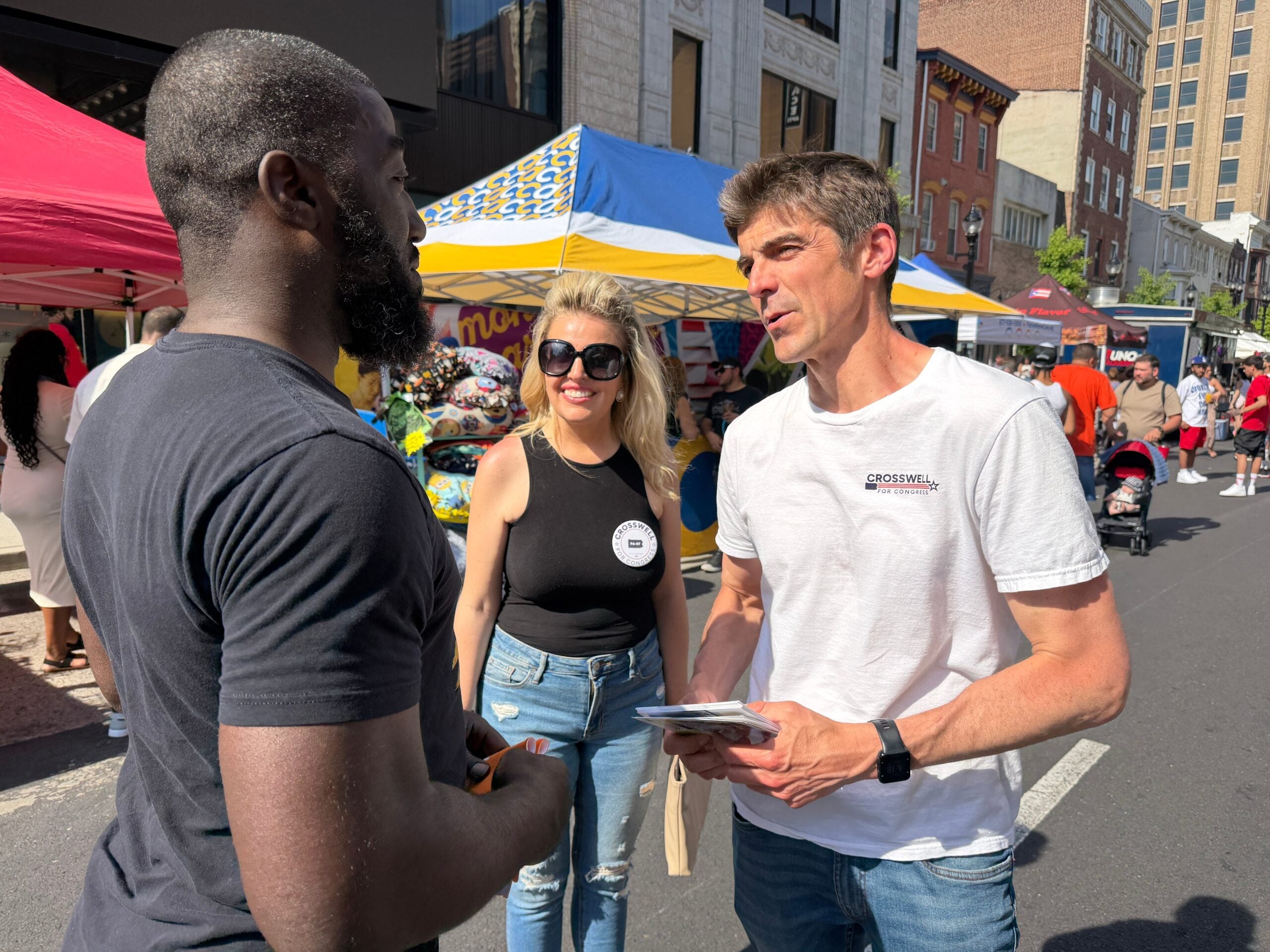 Ryan Crosswell speaks to a voter