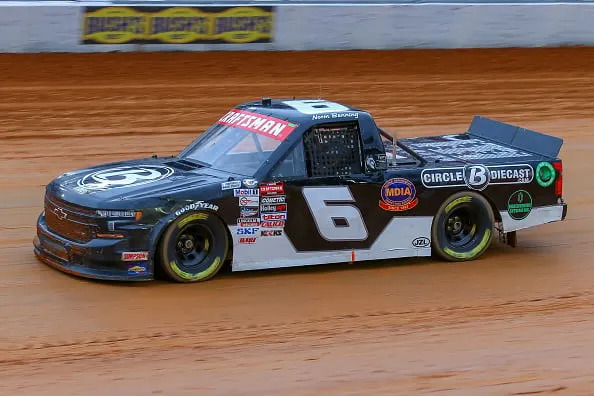 BRISTOL, TN - APRIL 08: NASCAR Craftsman Truck Series driver Norm Benning (6) races during a heat race for the NASCAR Craftsman Truck Series Weather Guard Truck Race on April 8, 2023 at Bristol Motor Speedway in Bristol, TN. (Photo by Chris McDill/Icon Sportswire via Getty Images)