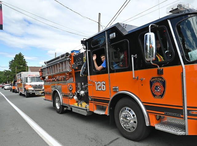 <p>Germania Hose Co. fire truck and ambulance take part in the 125th anniversary of the Borough of Dupont.</p>
<p>Tony Callaio | For Sunday Dispatch</p>