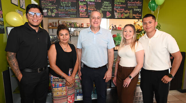 <p>City of Pittston Mayor Michael Lombardo, center, was on hand for the ribbon-cutting ceremony at Angy’s Tropical Juice Bar, 14 Market St., Pittston. From left: Milton Perez, Angy Rodriguez (owner), Lombardo, Natalie DeRose, and Edwin Perez.</p>
<p>Tony Callaio | For Sunday Dispatch</p>
