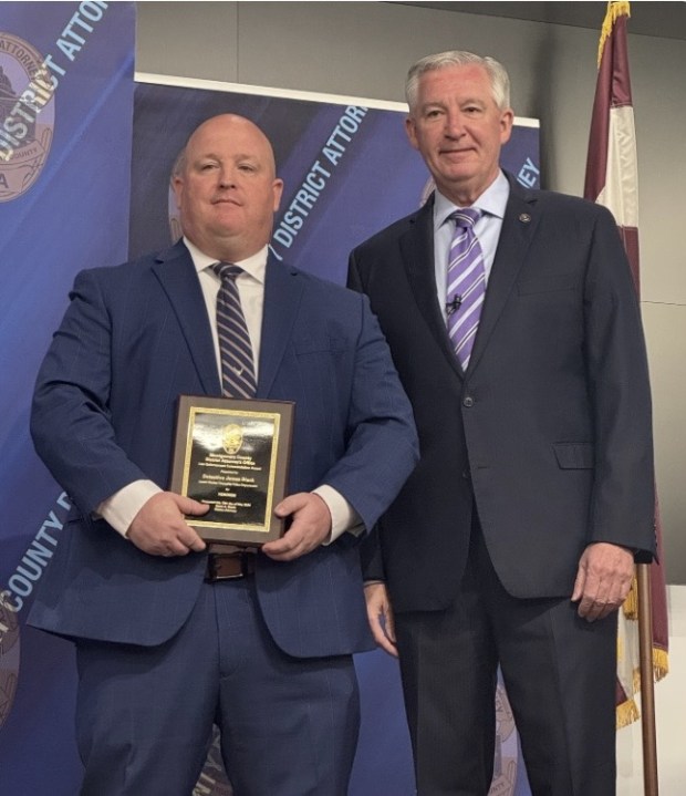 Lower Merion Detective James Black receives a commendation for heroism from District Attorney Kevin Steele. (Photo courtesy Montgomery County District Attorney)