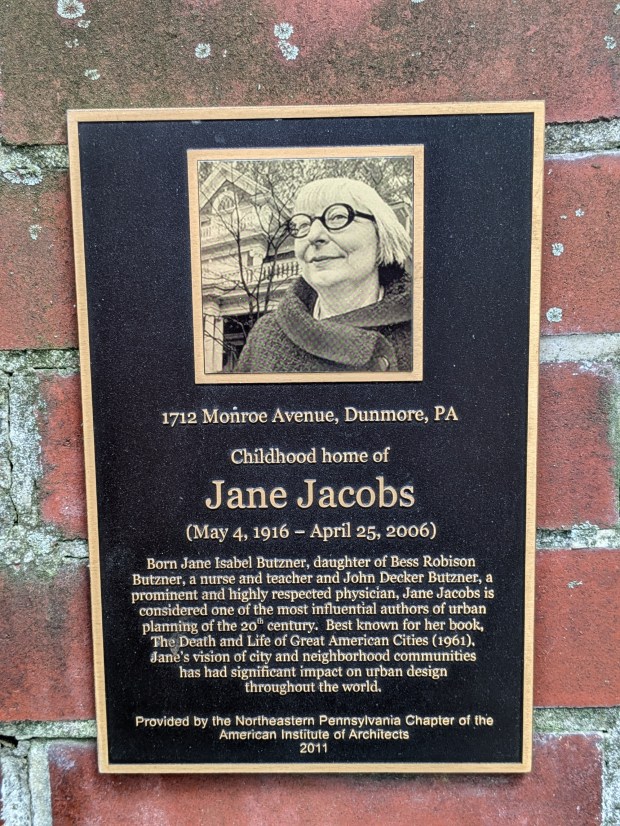 Jane Jacobs was born Jane Isabel Butzner on May 4, 1916, when her family lived on Electric Street in Scranton. When she was 5 they moved about a mile away to a house on Monroe Avenue in Dunmore. In April 2011 the Northeastern Pennsylvania Chapter of the American Institute of Architects unveiled this plaque honoring Jacobs at the front of the Dunmore property, shown here in May 2026. (STAFF PHOTO)