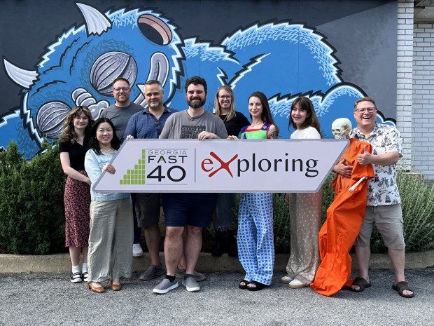 Employees of NeoPangea and new parent company Exploring, Inc., honor Exploring's fourth consecutive nomination to the Atlanta Association for Corporate Growth's Georgia Fast 40 list. (Courtesy of NeoPangea)