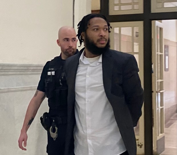Jamaul Wright is escorted by a deputy sheriff to a Montgomery County courtroom for his trial on gun charges. (Photo by Carl Hessler Jr. - MediaNews Group)
