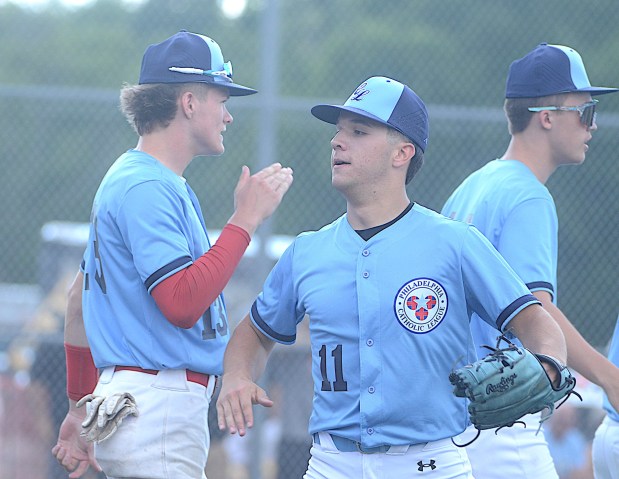 Bonner-Prendergast's Jake Gorman, right, is congratulated after throwing a scoreless inning for the Catholic League in the Carpenter Cup final against Delco on Monday. (PETE BANNAN-MEDIANEWS GROUP)