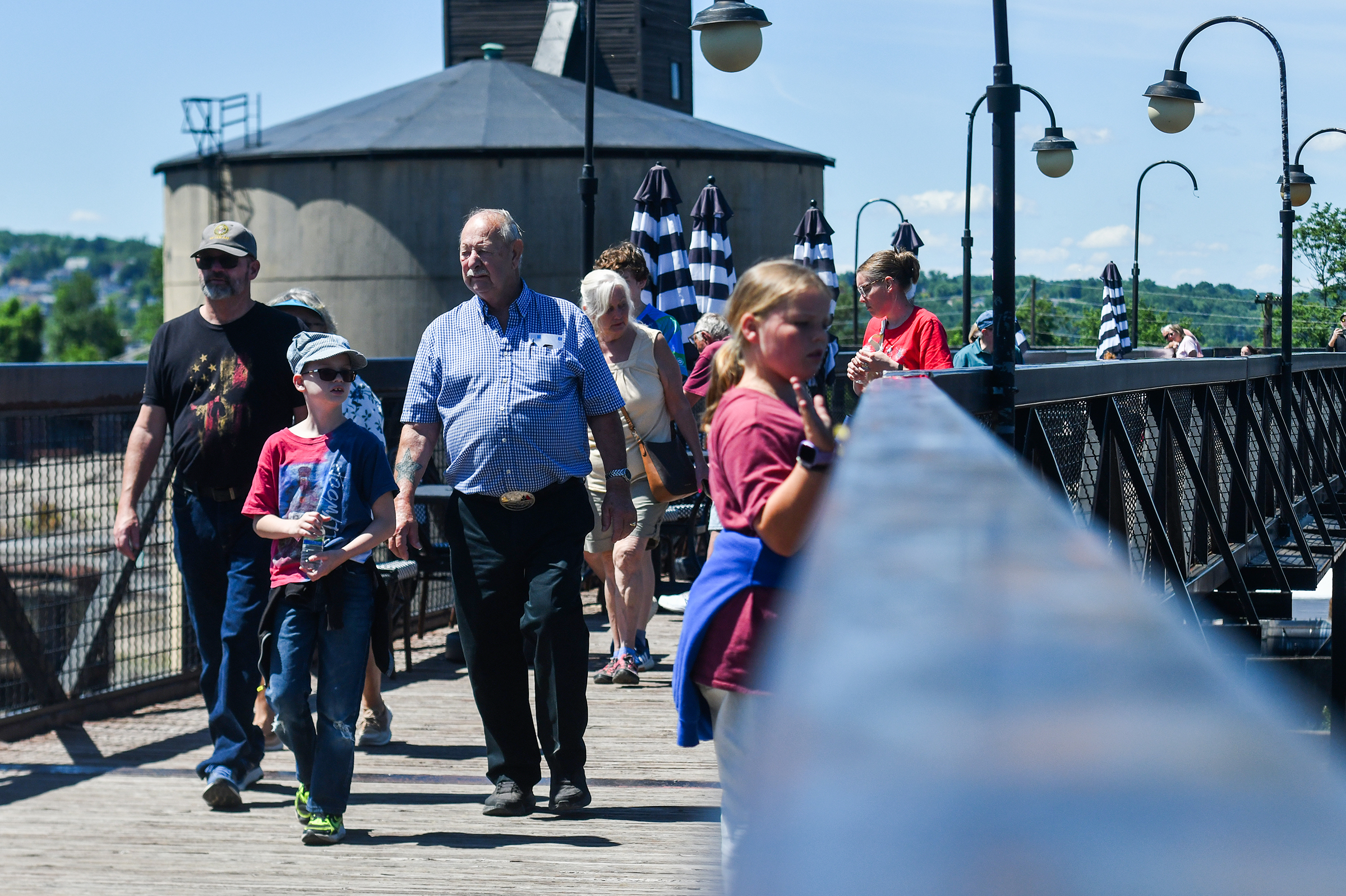 People walk the food bridge from the Steamtown National Historic...