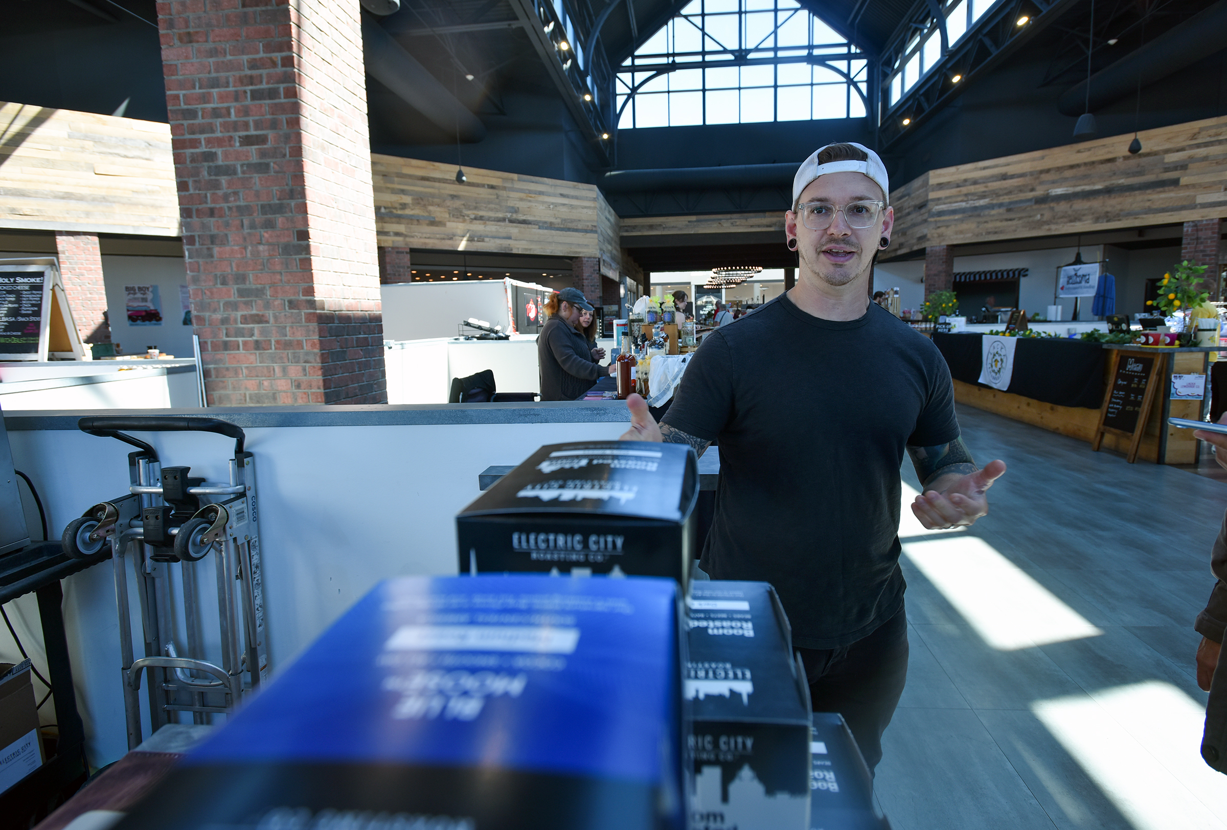 Kyle Mervau, co-owner of Electric City Roasting, discusses business during...