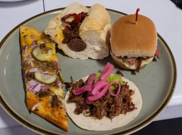 A sample plate of cheeseburger flatbread, sweet Italian beef sausage, cold-smoked pit beef slider, and smoked chuck roast was served for sampling at the launch celebration of the Pennsylvania Beef Trail on Friday, May 29, 2026, at Saucony Creek Brewing Co. in Kutztown. The council created an online resource that highlights and maps out nominated beef dishes at Pennsylvania restaurants. (Sharon Merkel/Special to The Morning Call)