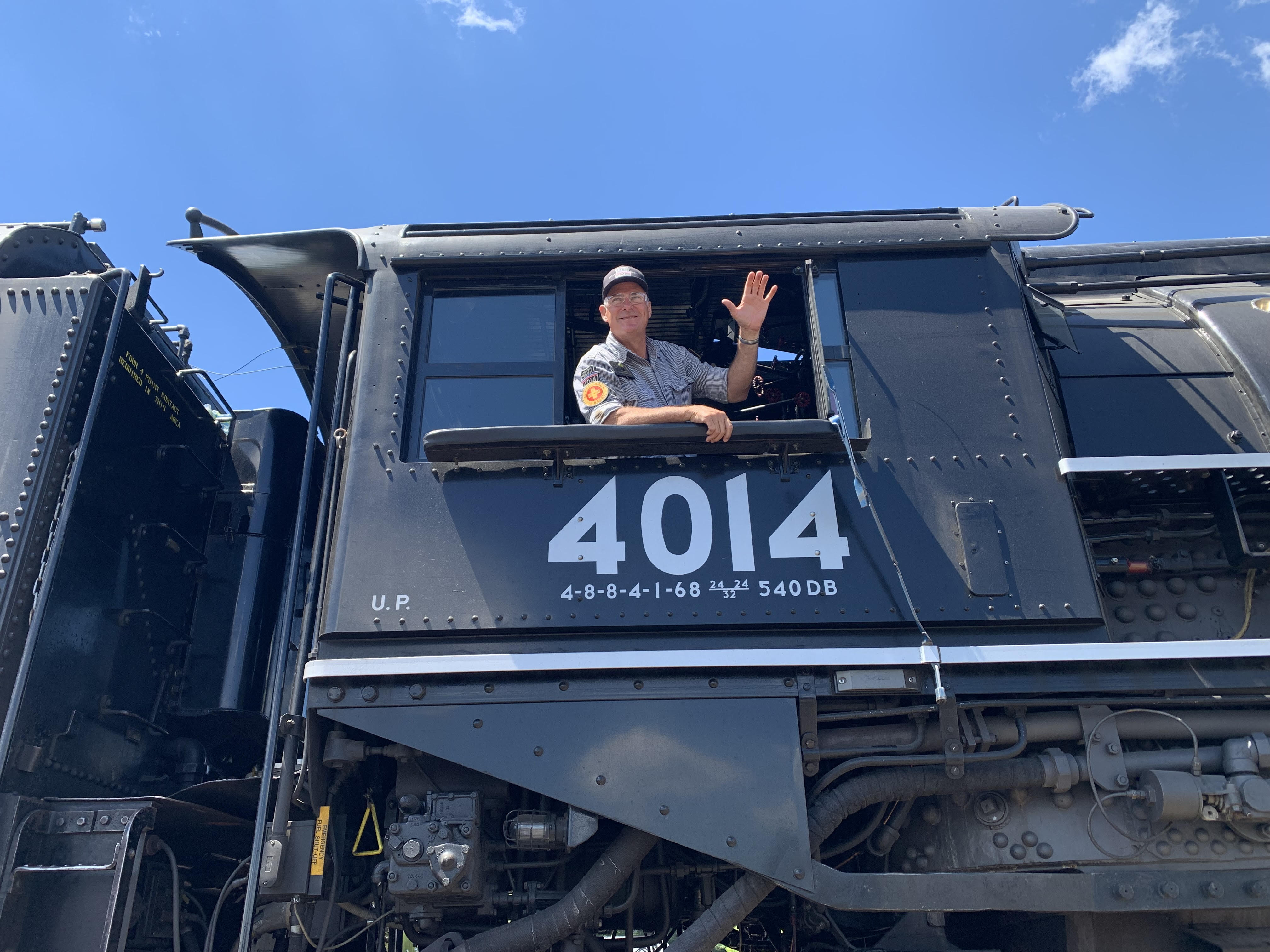 Union Pacific train engineer Ed Dickens in the cab of...