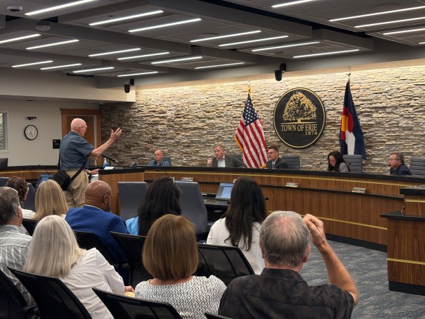 The Erie Town Council's chambers were at capacity Tuesday evening as residents spoke about a potential deal to sell the town's mineral rights. (Staff writer/Julia King)
