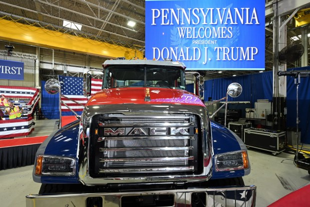 A Mack truck and signage welcomes President Donald Trump on Tuesday, June 23, 2026, to the Mack Truck plant in Lower Macungie Township. (April Gamiz/The Morning Call)