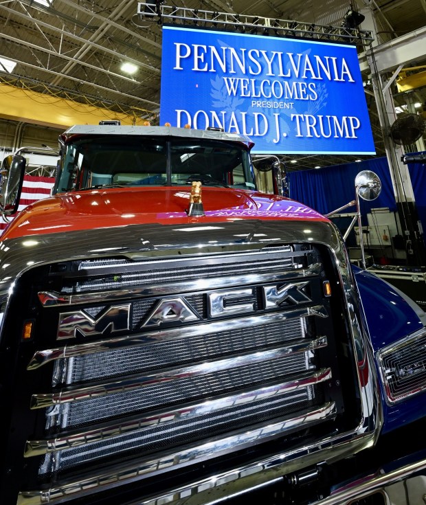 A Mack truck and signage welcomes President Donald Trump on Tuesday, June 23, 2026, to the Mack Truck plant in Lower Macungie Township. (April Gamiz/The Morning Call)