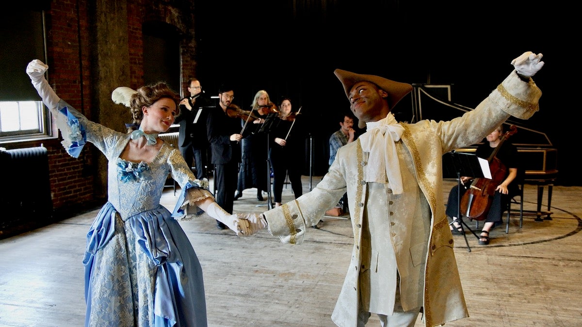Julia Bengtsson and Patrick Pride pose for photo while demonstrating their performance