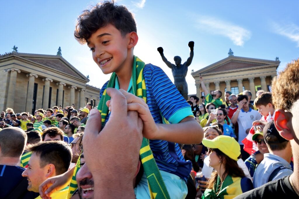 Brazilian fans rally on the steps of the Art Museum.