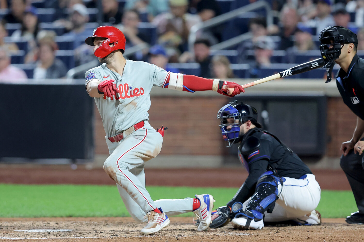 Philadelphia Phillies shortstop Trea Turner (7) follows through on an RBI single against the New York Mets during the seventh inning at Citi Field.