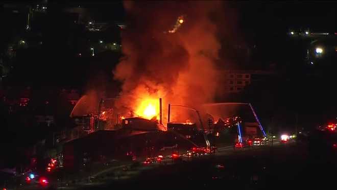a massive building fire in allentown has knocked out power to thousands of residents.