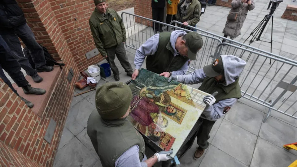 Staff with the National Parks Service replace the plaques that were part of the ‘Freedom and Slavery in the Making of a New Nation’ exhibit at the President’s house on February 19, 2026 in Philadelphia, Pennsylvania. On January 22nd the exhibit was removed as part of the Trump administration’s policies, and on President’s day U.S. District Judge Cynthia Rufe ordered the exhibit’s restoration.(Photo by Matthew Hatcher/Getty Images)