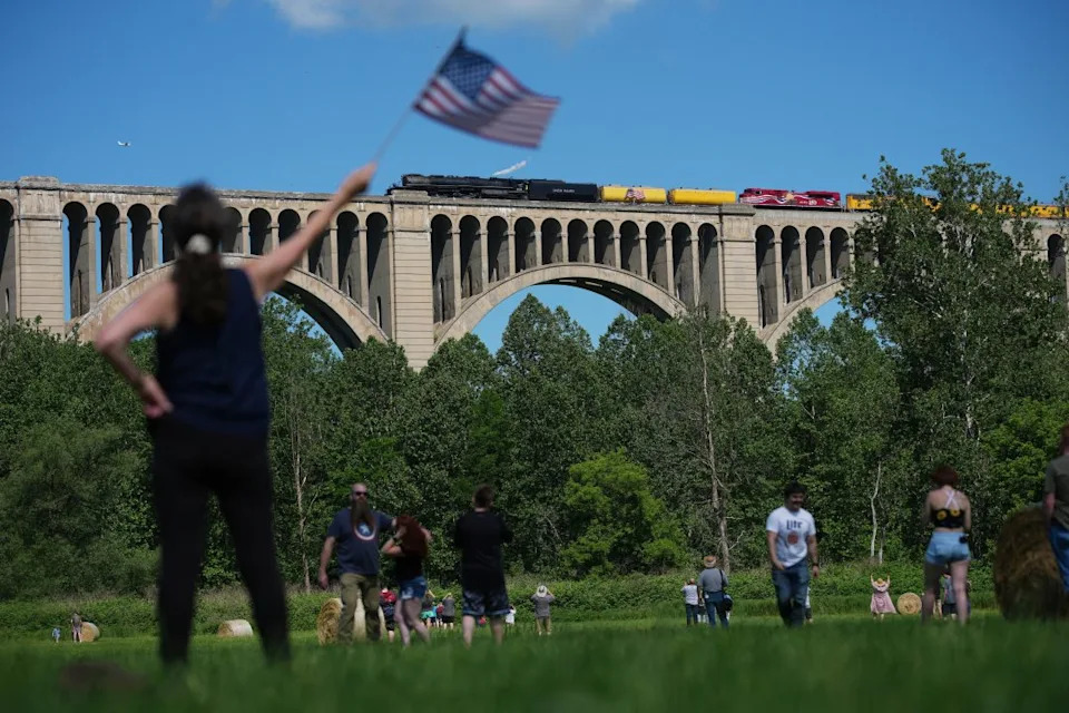 People photograph the steam locomotive Union Pacific’s Big Boy No. 4014, as it passes its travels across the Tunkhannock Creek Viaduct in Nicholson, Pa., Saturday, June 13, 2026, as part of a coast-to-coast tour to celebrate America’s 250th anniversary. (AP Photo/Matt Rourke)