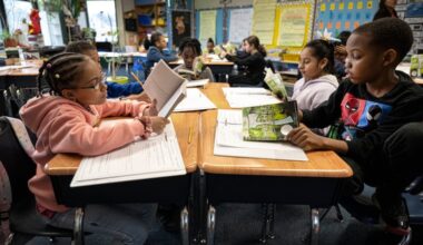 Fourth grade students, Cheyenne Wise, left, and Josiah Forney, read a book on Tuesday, Jan 30, 2024, during a reading class at the Hancock Elementary School in Norristown, Pa.