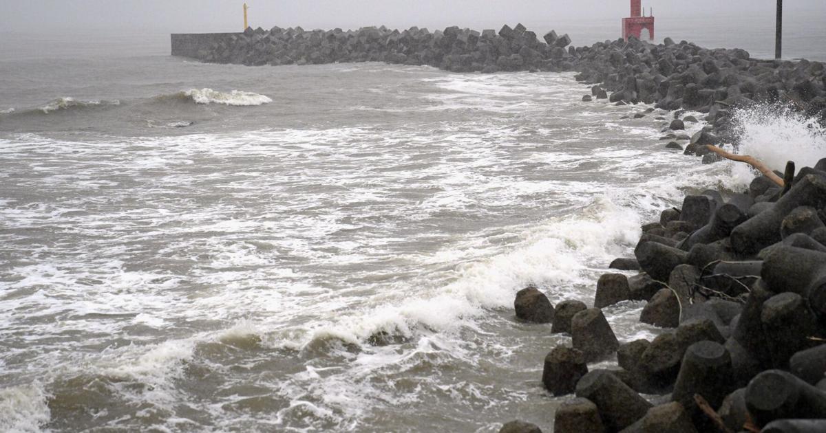 Two tropical storms pound Japan, causing flooding and landslides | Associated Press