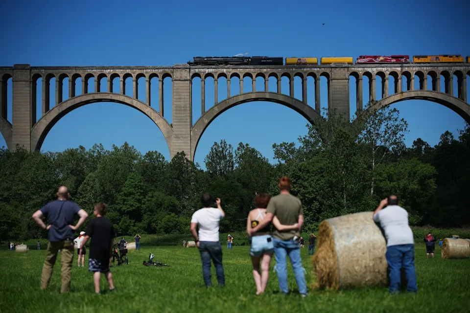 People gather to see the steam locomotive Union Pacific’s Big Boy No. 4014, travel across the Tunkhannock Creek Viaduct in Nicholson, Pa., Saturday, June 13, 2026, as part of a coast-to-coast tour to celebrate America’s 250th anniversary. (AP Photo/Matt Rourke)