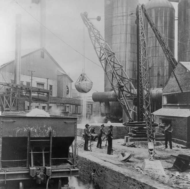 Blast Furnace Male workers standing below a bucket attached to a crane, loading slag into a blast furnace in Pittsburgh, Pennsylvania, USA, circa 1930. Pittsburgh was long noted for its steel industry, which waned towards the end of the 20th century. (Photo by Archive Photos/Getty Images)
