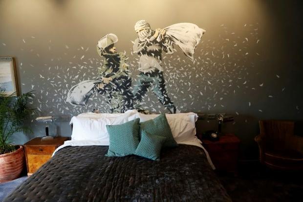 Banksy's newly opened Walled Off hotel in the West Bank town of Bethlehem  has graffiti inside ...