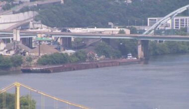 Barge repositioned after caught drifting ashore due to high winds in Pittsburgh