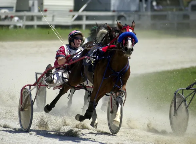 Sherry Claypoole races during the Wattsburg Fair on Aug. 14, 2001.