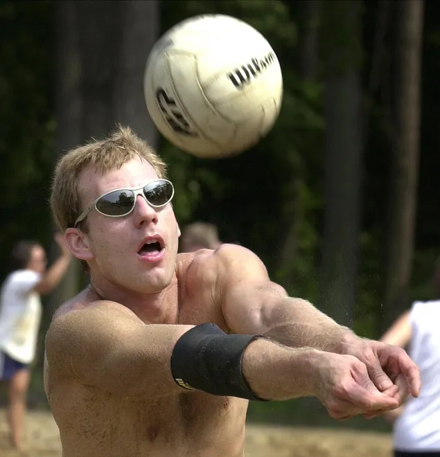 John Welka, of Erie, returns a serve in August 2001 during the volleyball tournament at Presque Isle's Beach 6 courts. He was partnered with Laura Beauty of Greenville and the two were pitted against Matt Soety of Erie and Jessica Long of Fredonia.