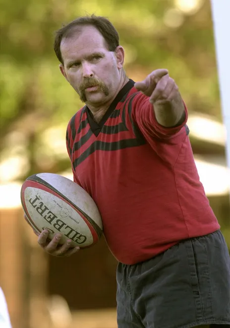 Pete Barry leads drills at an Erie Rugby Club practice at Baker Field in August 2001.