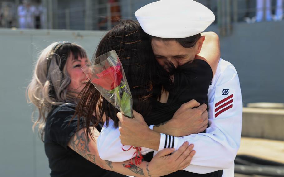 Gilstrap embraces a woman.