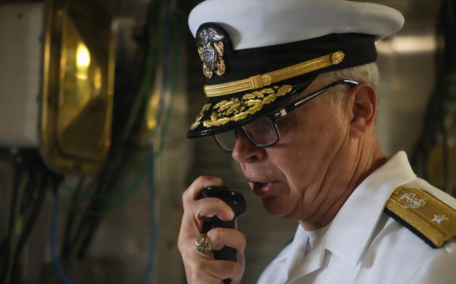The admiral addresses the crew by intercom.