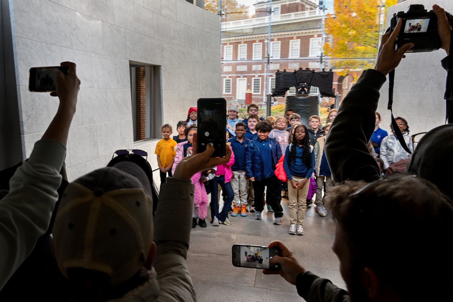 Students on a field trip from the Christian Academy in Brookhaven, Delaware County, pose for a group photo in front of the Liberty Bell in Independence National Historical Park.
