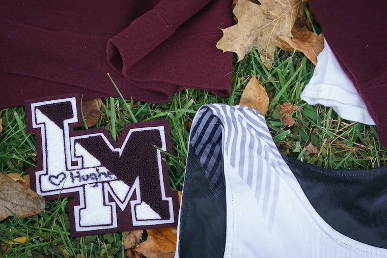 Items and messages left at a memorial for principal Sean Hughes, the author's husband, at Lower Merion High School in November 2021.