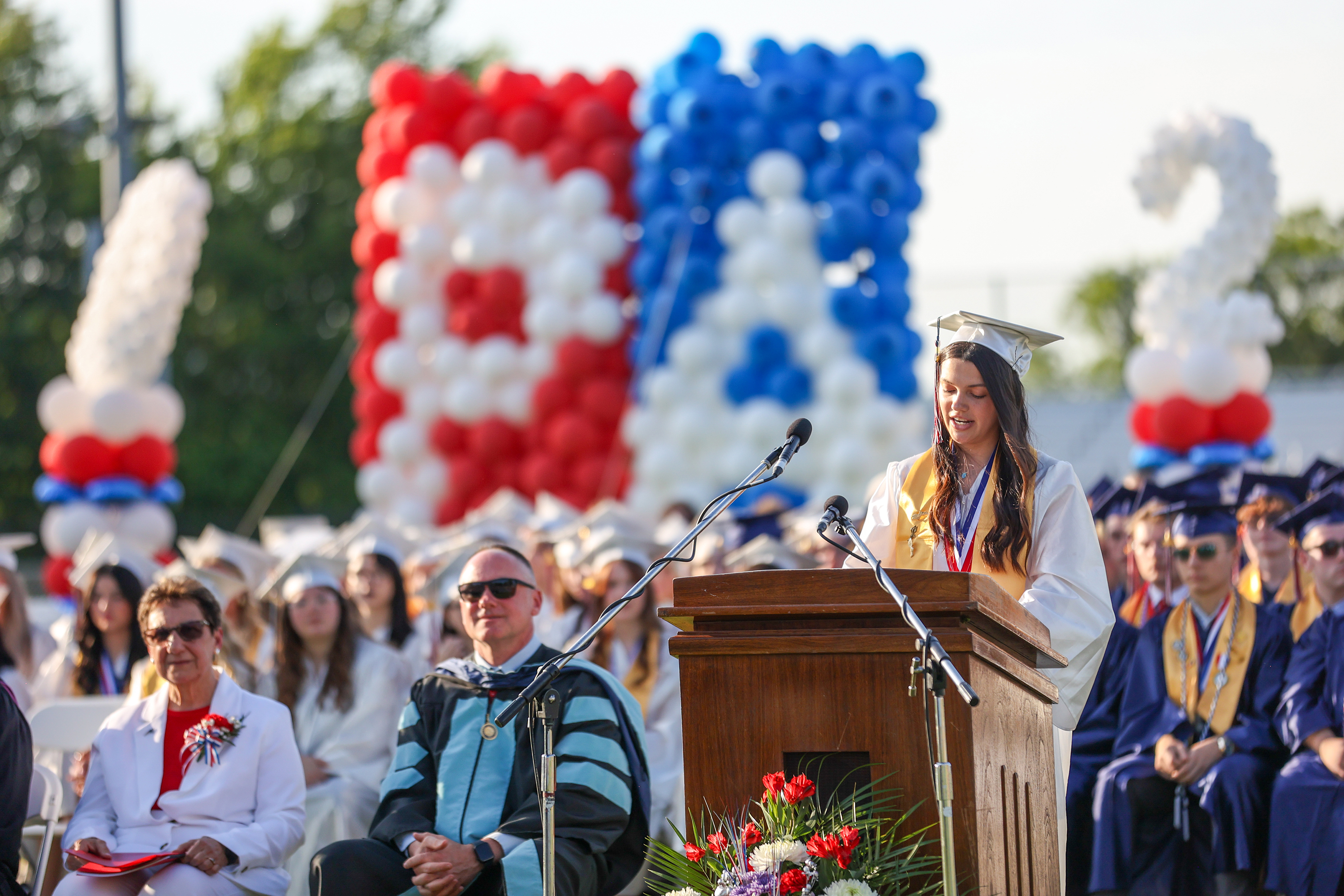 Annika Lien, one of five valedictorians, speaks during the 60th...