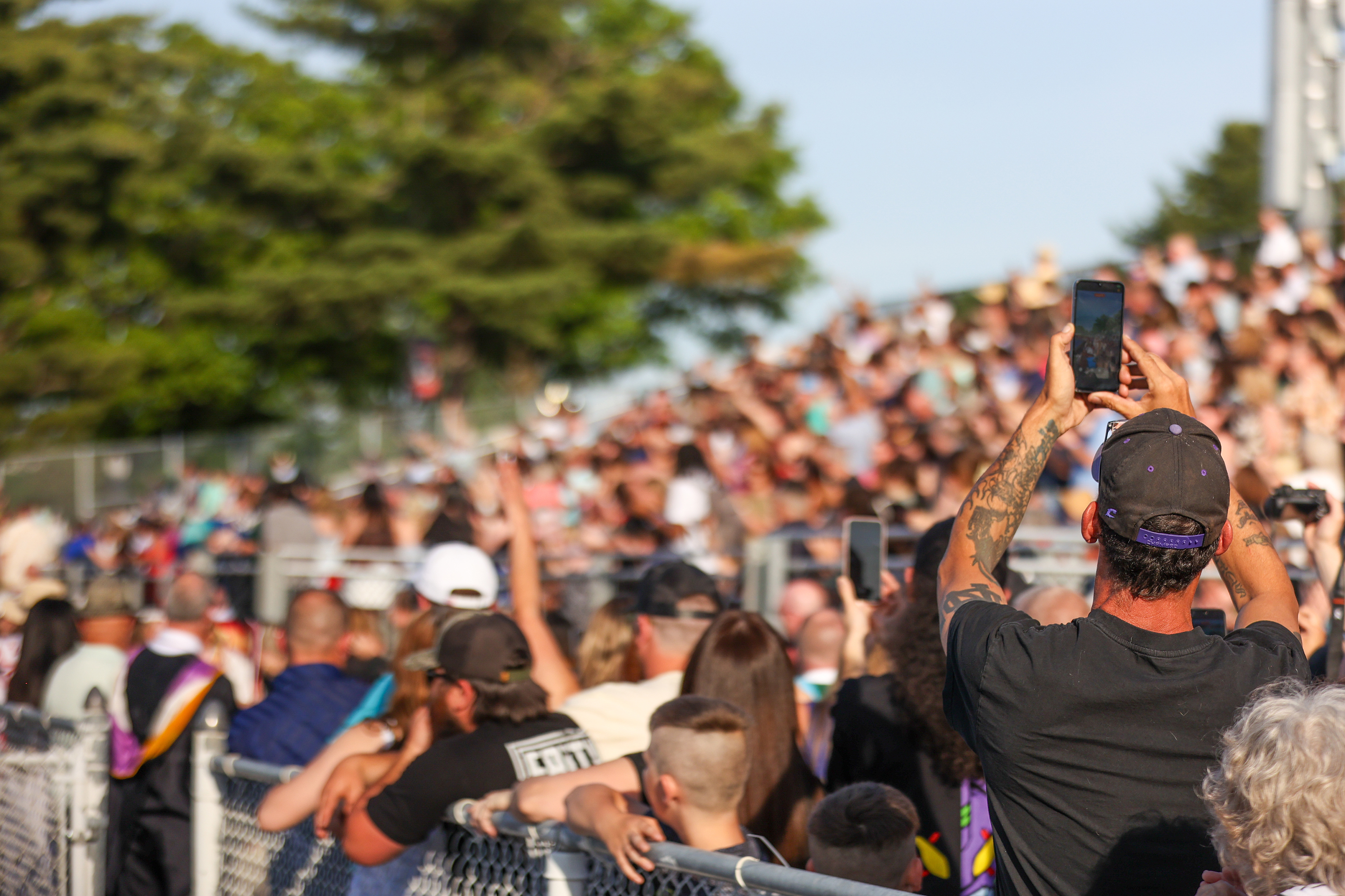 Loved ones take photos and videos during the 60th annual...