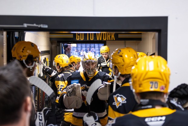 Penguins goaltender Sergei Murashov, center, with his Wilkes-Barre/Scranton teammates. COURTESY OF THE WBS PENGUINS