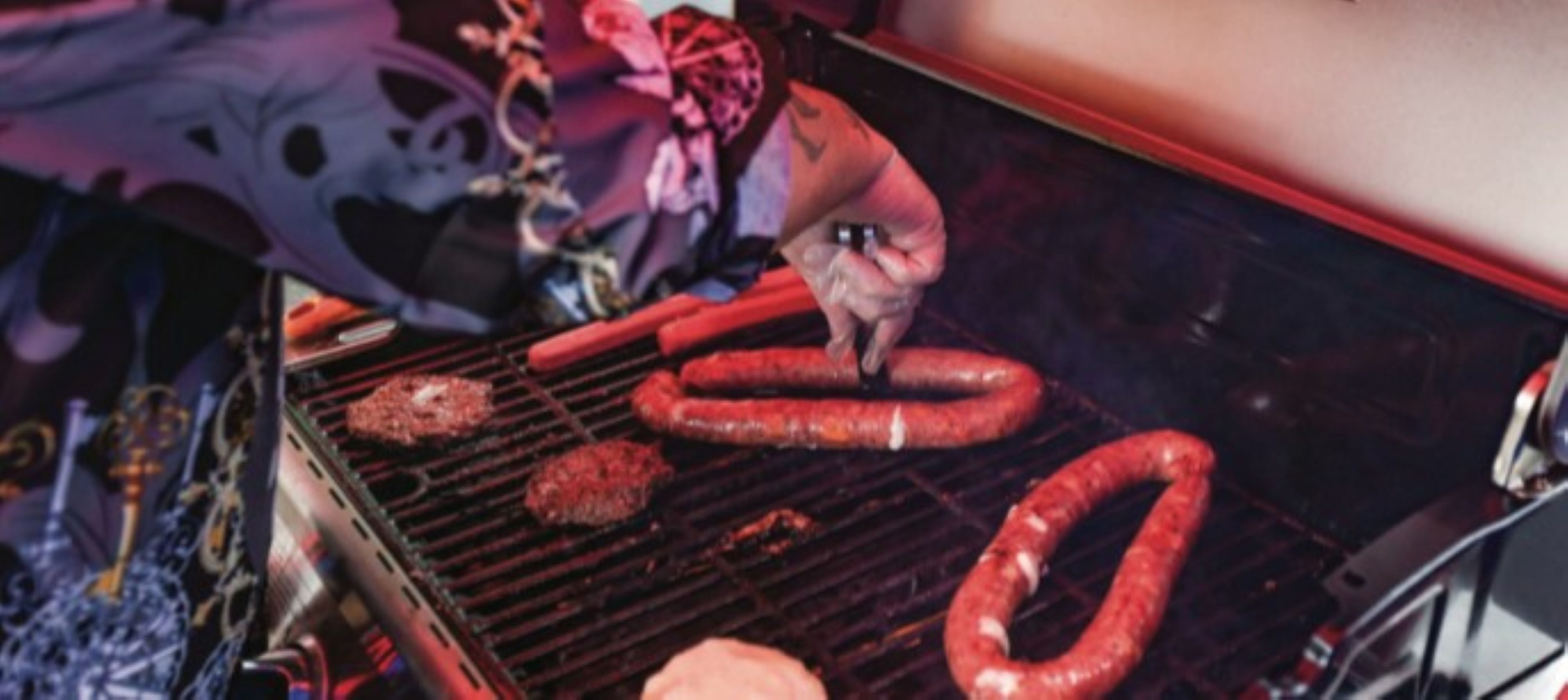 Roy Propes, of Lake Ariel, grills two kielbasa rings at...