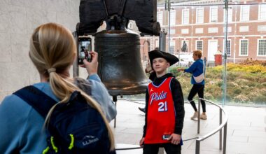 Amanda Williams photographs her son Corwin, 13, in front of Liberty Bell in Independence National Historical Park.