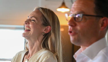 Scranton Mayor Paige Cognetti laughs with Governor Josh Shapiro during a press conference.