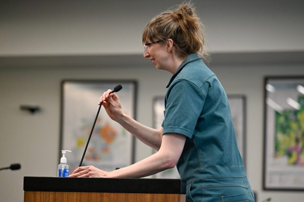 Resident Emily Brecht speaks at a special Town Council meeting in Erie on Tuesday. (Matthew Jonas/Staff Photographer)