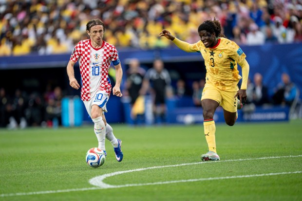 Croatia's Luka Modric dribbles past Ghana midfielder Caleb Yirenkyi during the second of Saturday's World Cup Group L game in Philadelphia. (Mikey Reeves/For MediaNews Group)