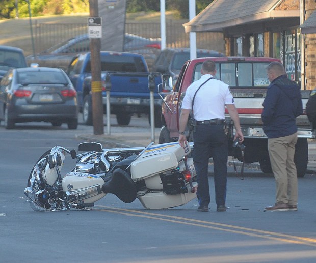 Police investigate the incident. (PETE BANNAN-DAILY TIMES)