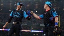 ARLINGTON, TEXAS - JULY 16: Jeff Hoffman #23 of the Philadelphia Phillies celebrates with Will Smith #16 of the Los Angeles Dodgers at the end of the eighth inning against the American League during the 94th MLB All-Star Game presented by Mastercard at Globe Life Field on July 16, 2024 in Arlington, Texas. (Photo by Sam Hodde/Getty Images)