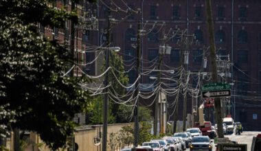 Power lines run along a neighborhood in Philadelphia. Credit: Matthew Hatcher/AFP via Getty Images