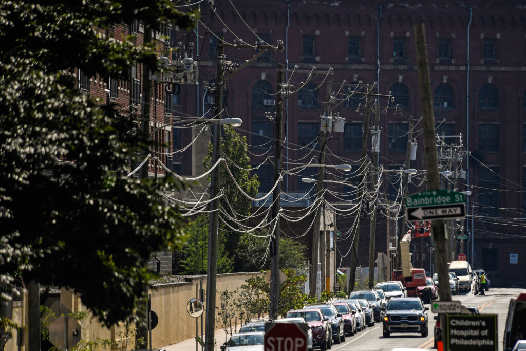 Power lines run along a neighborhood in Philadelphia. Credit: Matthew Hatcher/AFP via Getty Images